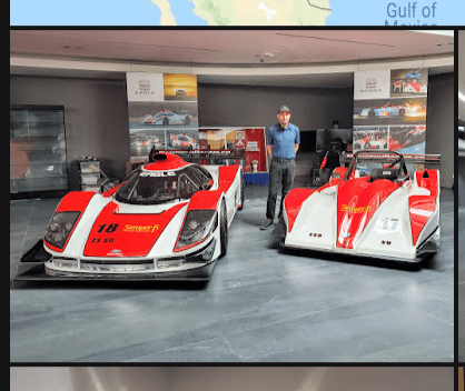 Patrick 'PJ' Losey standing between Davidson Racing #16 Daytona Prototype and #17 Open-Top Prototype